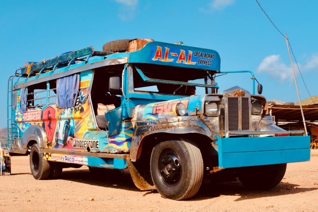 a blue jeepney as one of the differences between Philippines and Germany