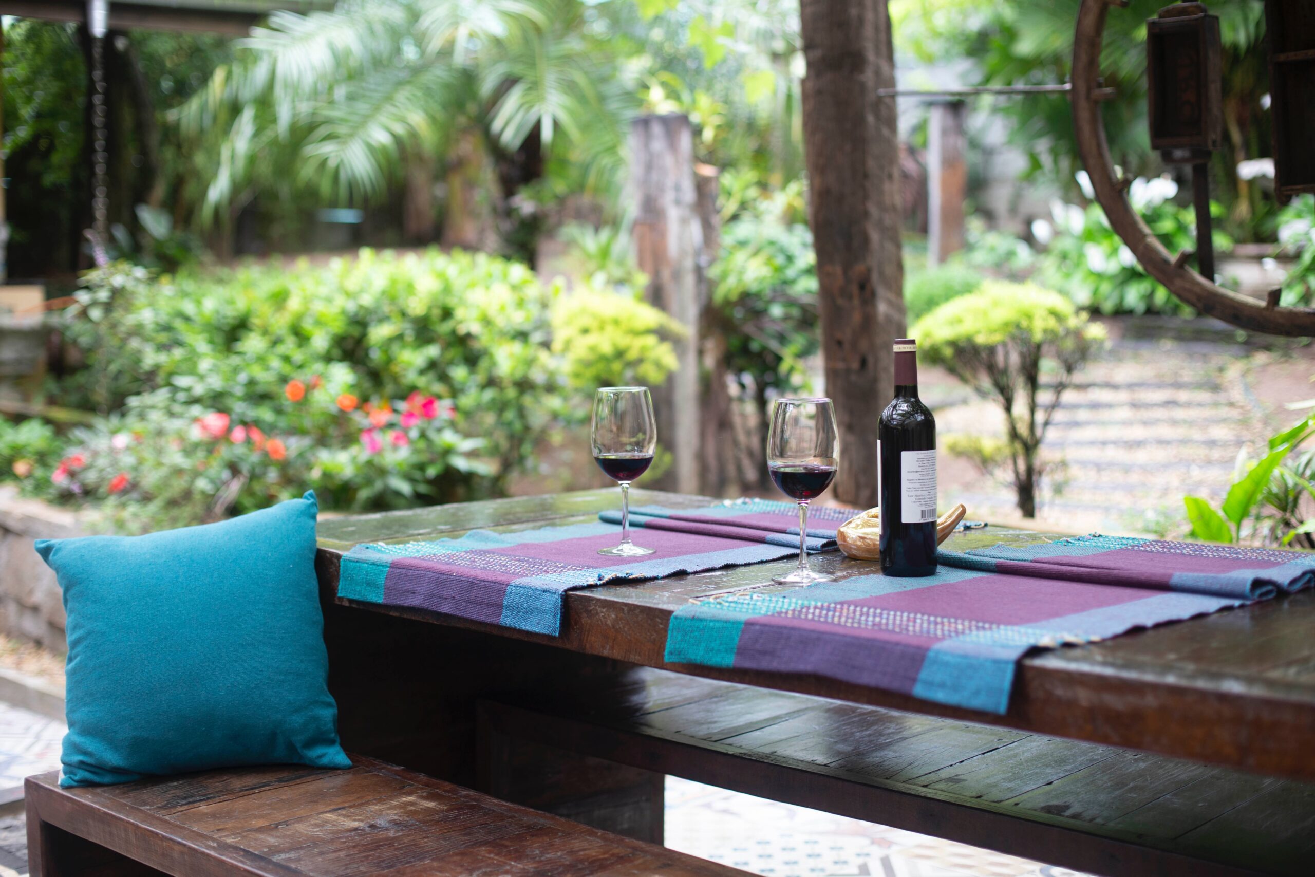 wine on a patio table for benefits of a staycation post