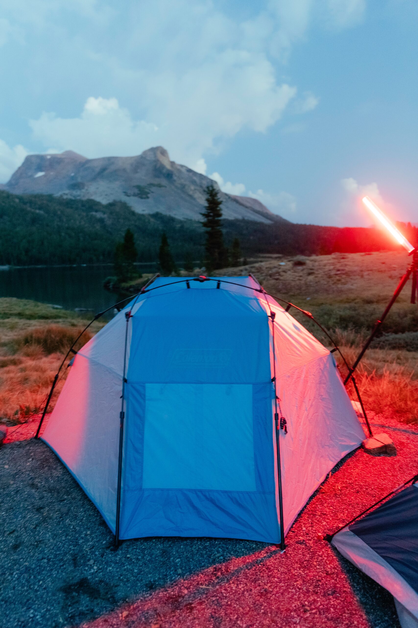 colorful tent in mountains during traveling to the mountains during sunset