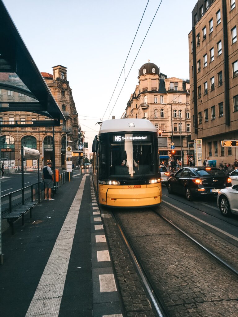 yellow train on tracks as part of the transportation things to know before moving to Germany